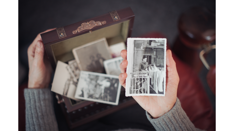 Senior woman discovering old photographs