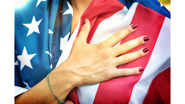 American Fan Putting Hand on Hearth During the National Anthem