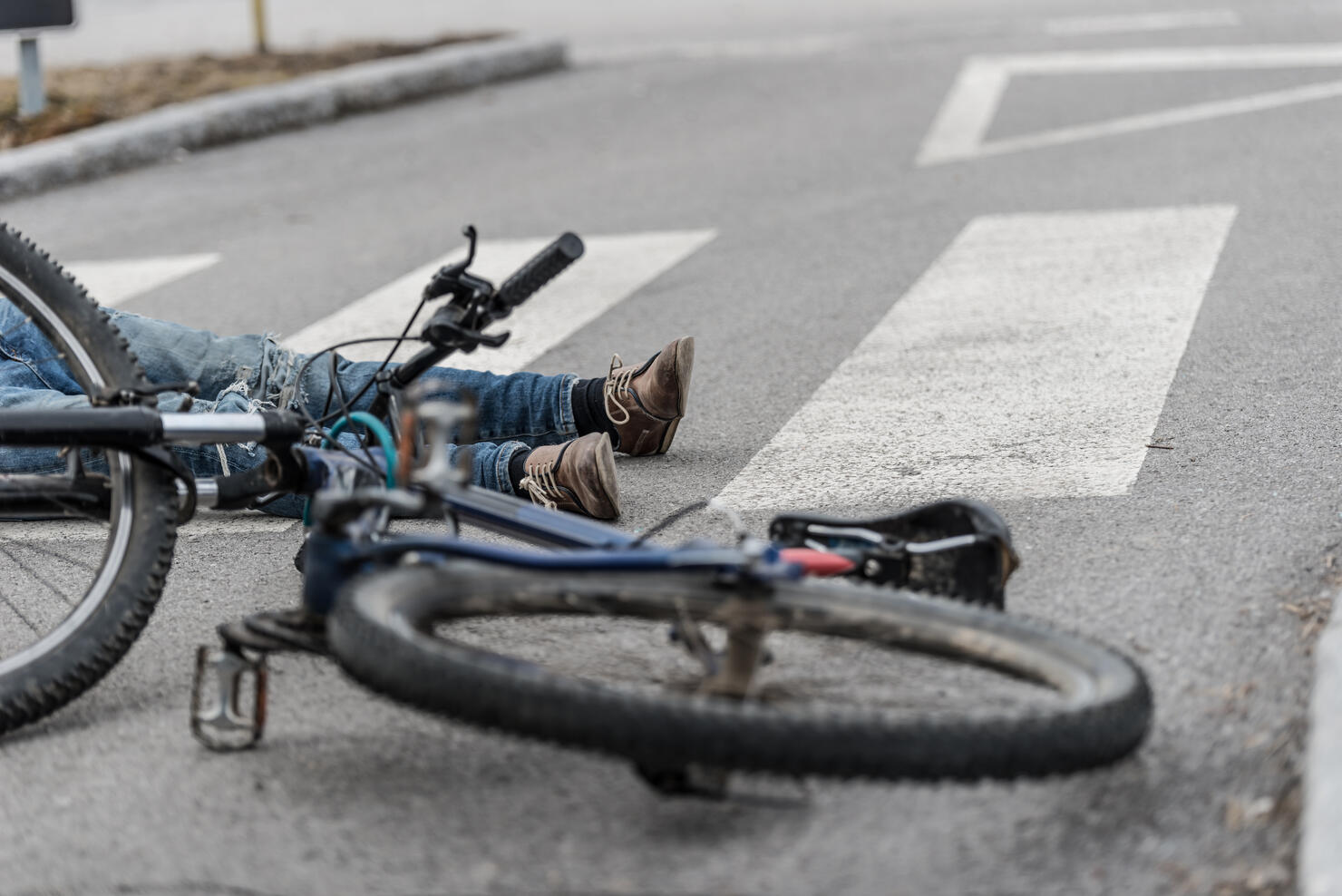 Traffic accident.Young man on bike hit by a car