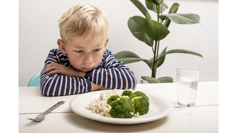 Boy does not want to eat his veggies