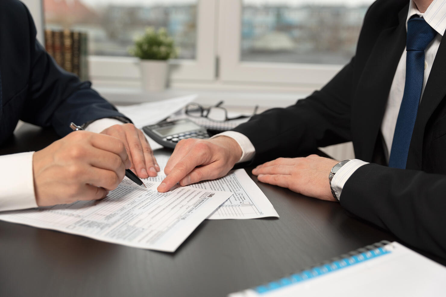 Tax advisor helps to complete US 1040 tax form