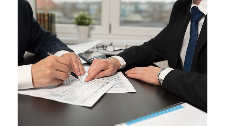 Tax advisor helps to complete US 1040 tax form