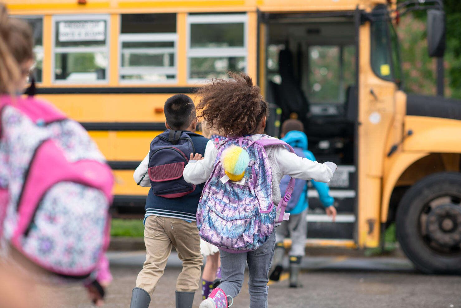 Kids getting onto the school bus
