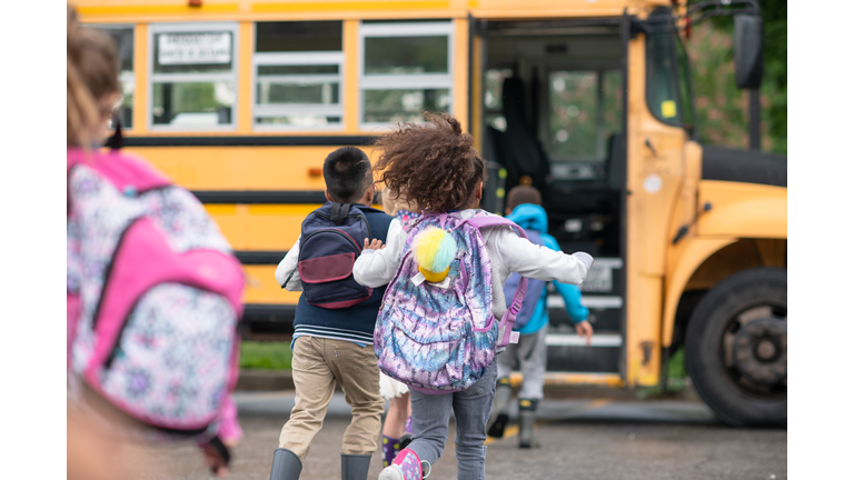 Kids getting onto the school bus