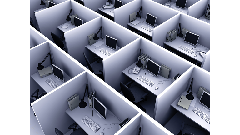 Aerial view of identical cubicles with desktop computers
