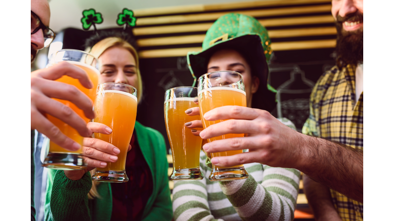 Group of Friends Celebrating St Patrick's Day at Beer Pub