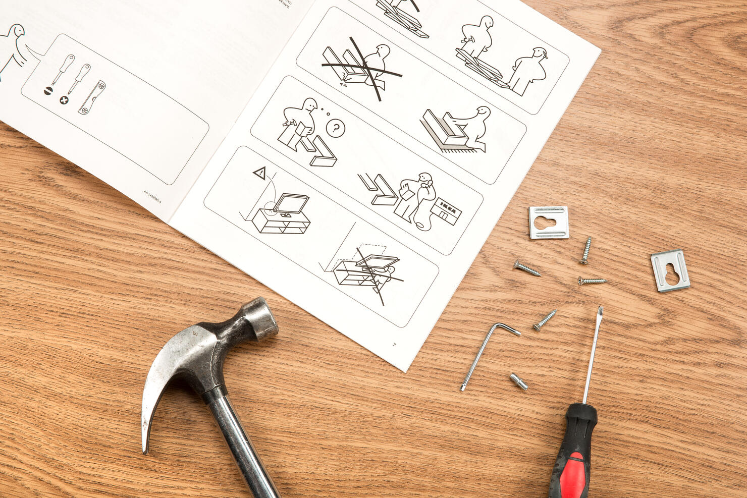 IKEA furniture assembling with instructions and tools.