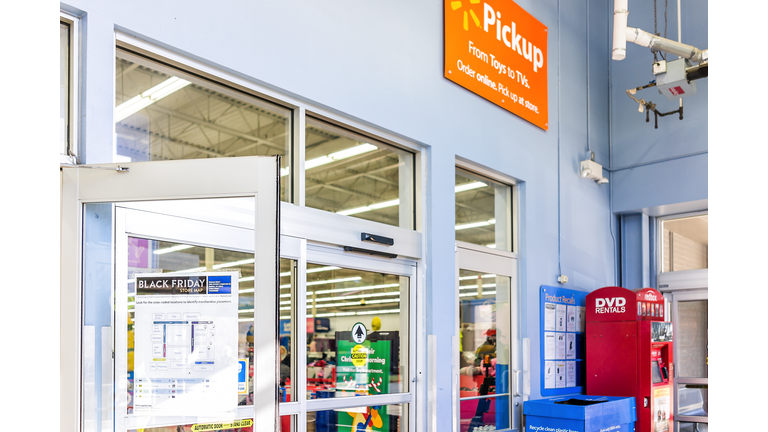 Black Friday sign in Walmart store entrance with map after Thanksgiving shopping consumerism in Virginia