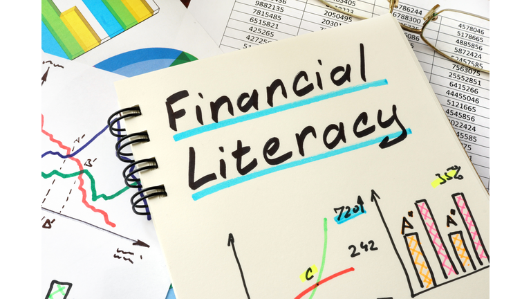 Financial Literacy written on a notepad sheet. Education concept.