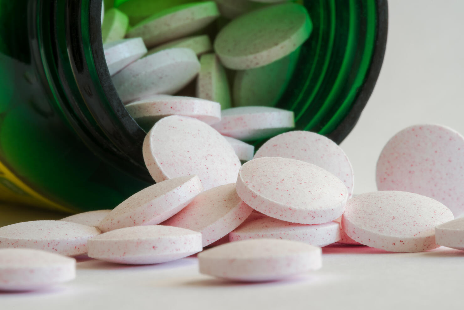 Melatonin Tablets Spilled from a Bottle