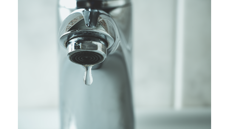 water drop dripping from the tap