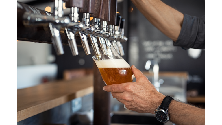 Pouring beer in glass