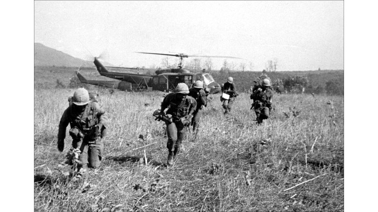 American soldiers get off helicopters during the o