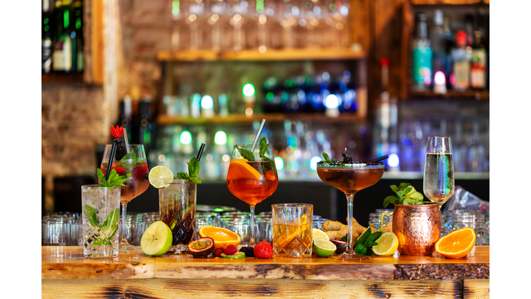 Assortment of alcoholic cocktails on a bar counter