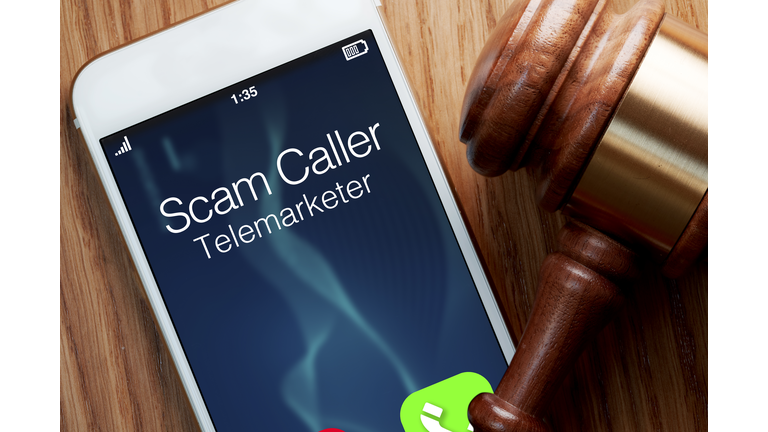 Telemarketer robocaller scam: legislation for smartphone with gavel