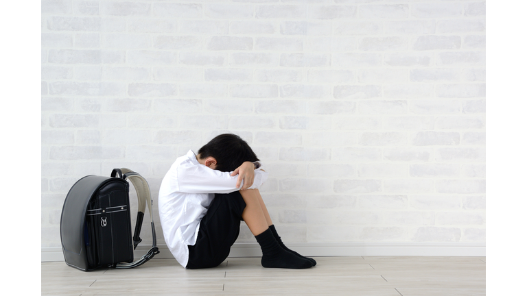 Child sitting alone in living room