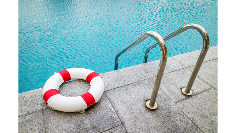 Life ring at swimming pool.emergency tire floating at swimming pool.