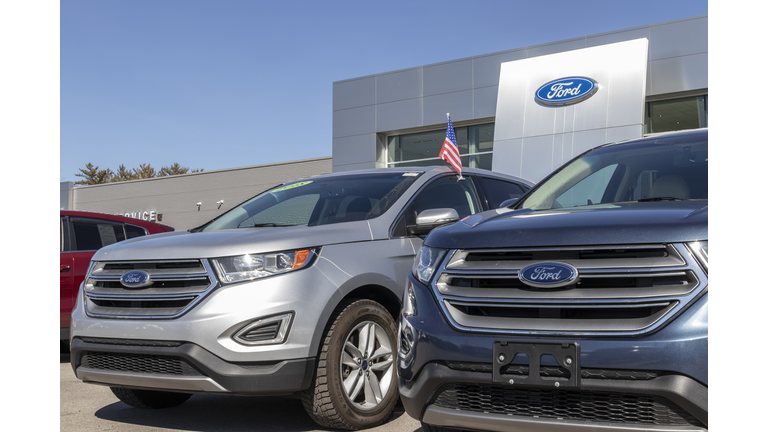 Ford SUV display at a dealership. Ford sells traditional gasoline, electric and hybrid SUV models.