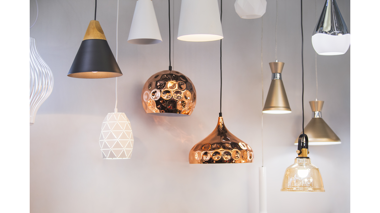 Different modern streamlined mirror copper chandeliers. Bubble metal copper shade pendant