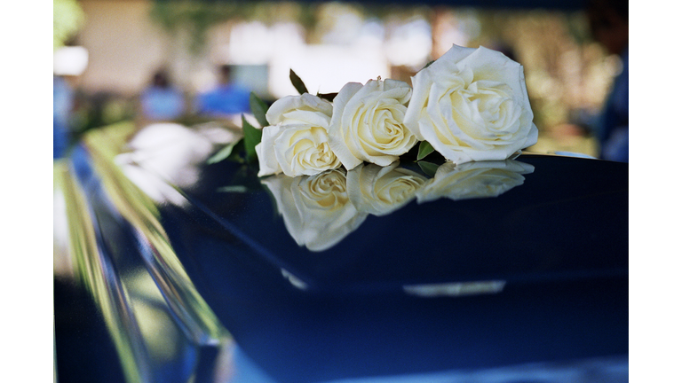 Flowers on funeral coffin