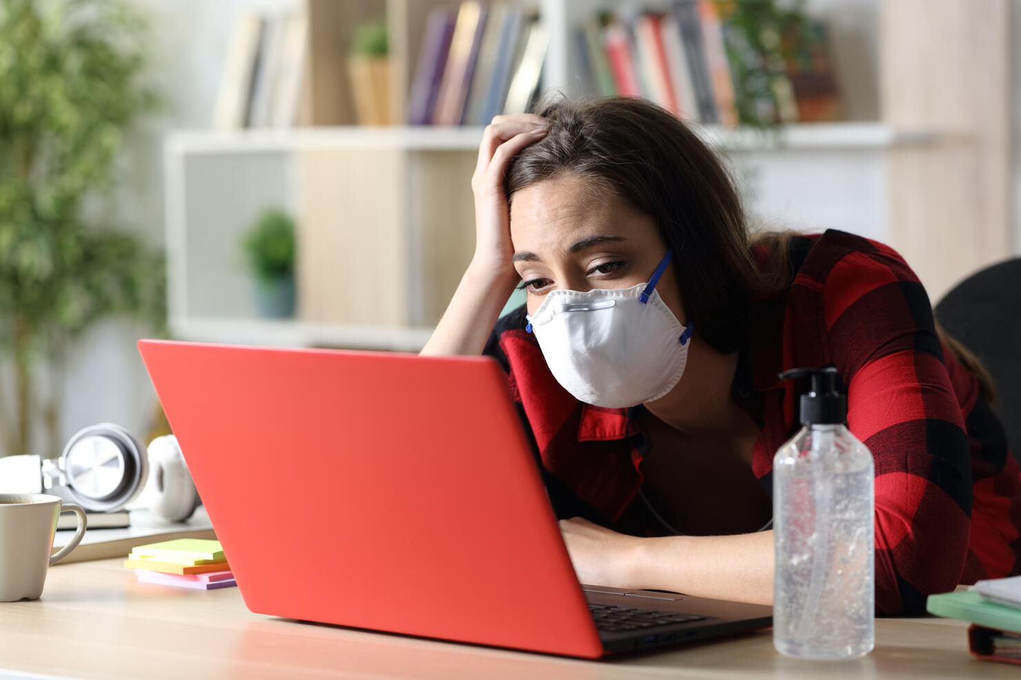 Bored student looking laptop in coronavirus confinement