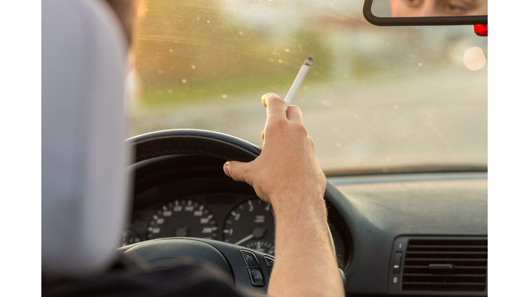 Smoking while driving a car