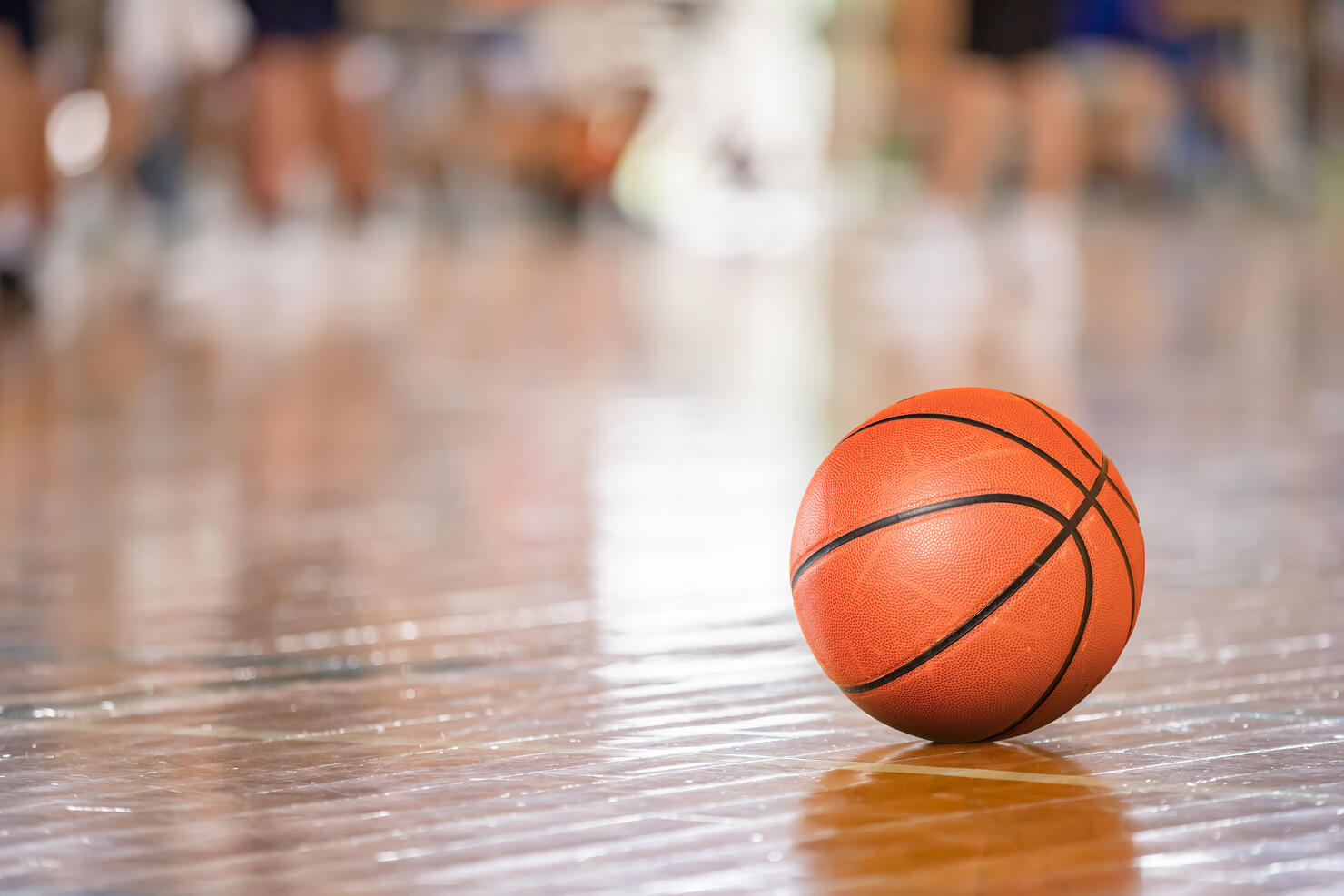 Bright gymnasium and basketball on the floor