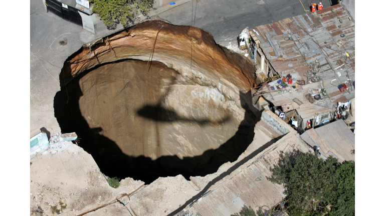 The shadow of an helicopter casts over t...