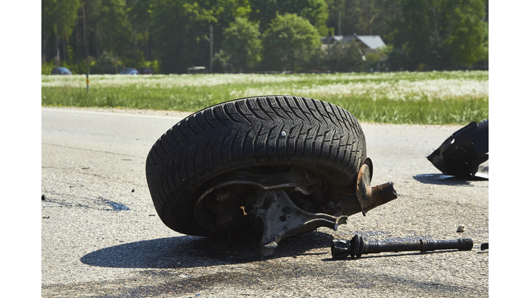 Parts of car after accident on a road