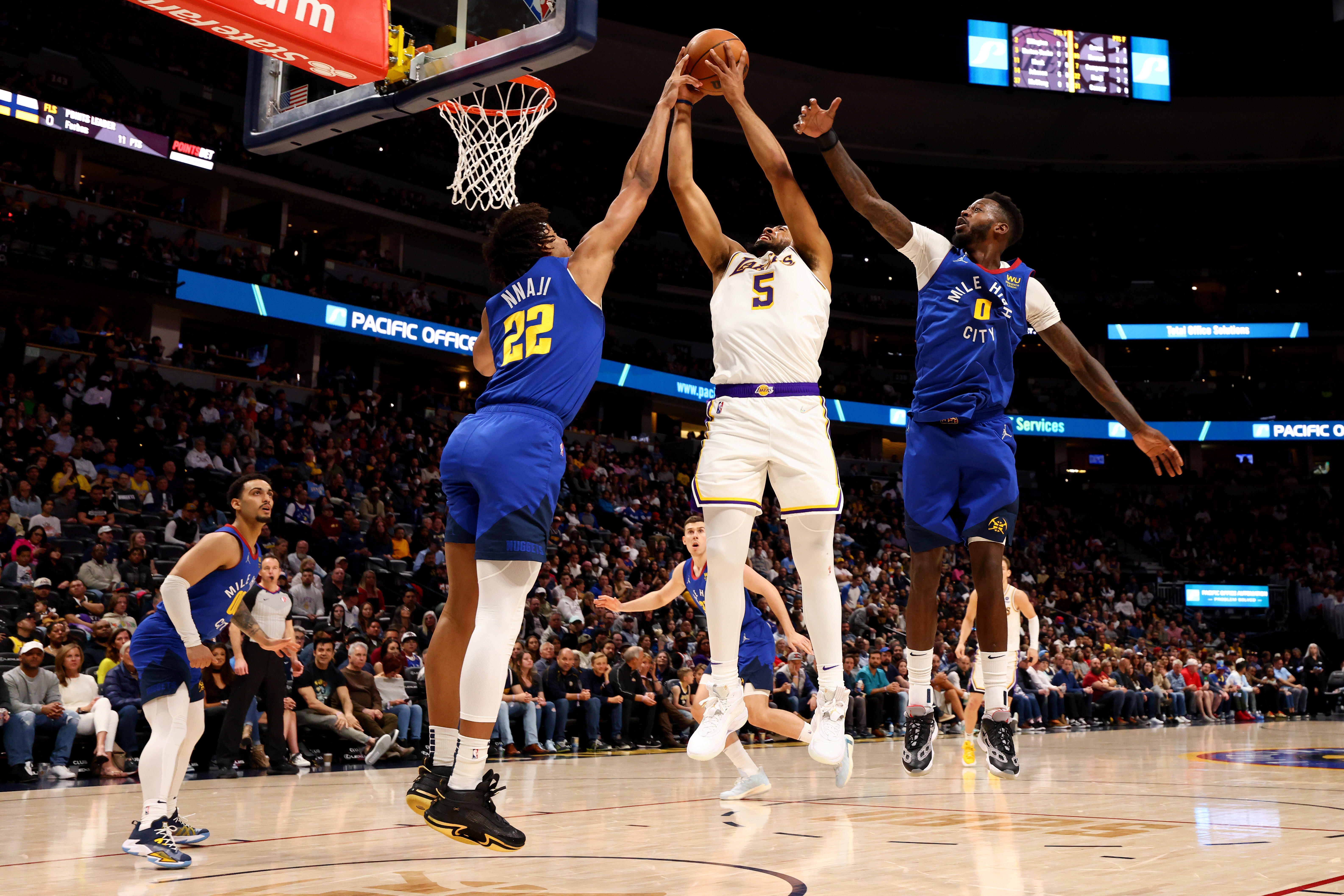 Reaves, Monk lead Lakers past Nuggets 146-141 in OT