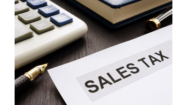 Sales tax. Papers on the office table.