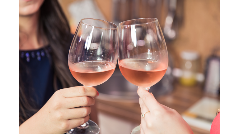 Close up of toasting with wine.