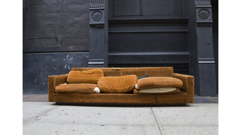 Orange couch on the street in Soho