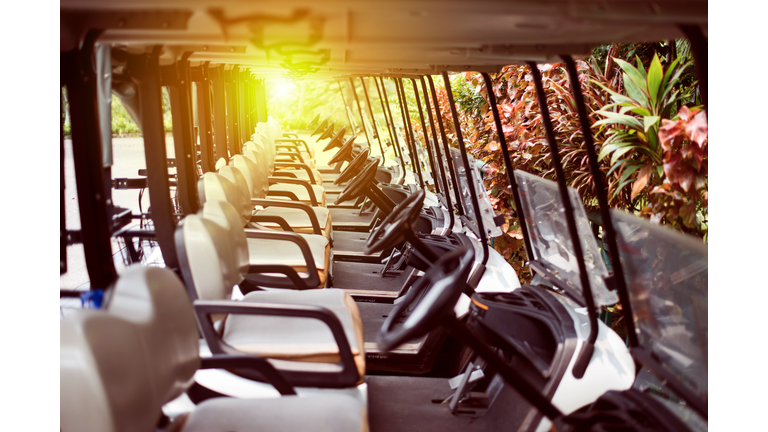 Golf car in a row