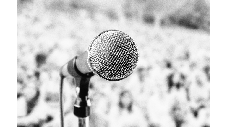 Microphone at outdoor music festival, with heavy film grain