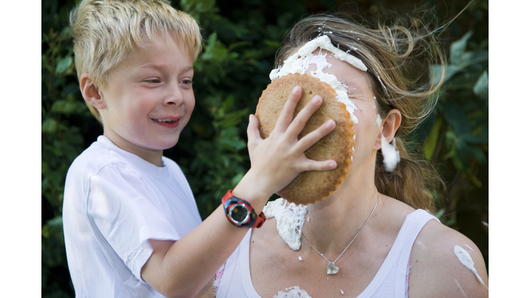 child hits mummy with custard pie