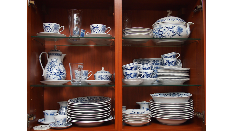 Crockery in wooden kitchen cabinet