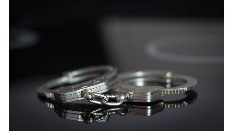 Handcuffs on the glass surface