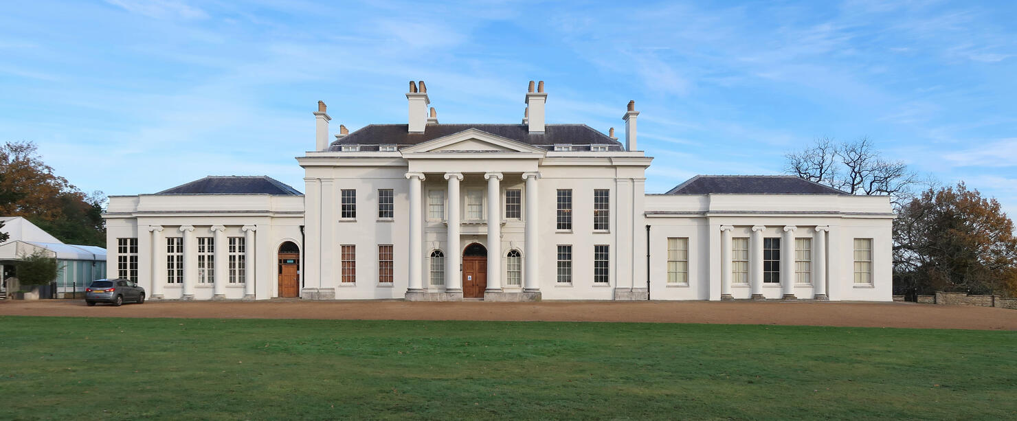 Public Hylands park with Georgian or Regency period mansion house or villa