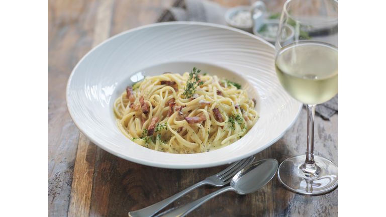Linguini carbonara made with smoked pancetta, fresh eggs, nutmeg, cream, parmesan cheese and black pepper