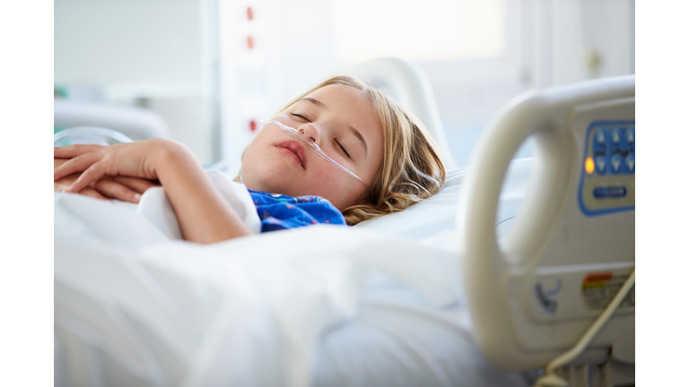 Young Girl Sleeping In Intensive Care Unit