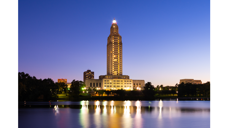 Louisiana State Capital and Arsenal Park at Dusk w/ lake