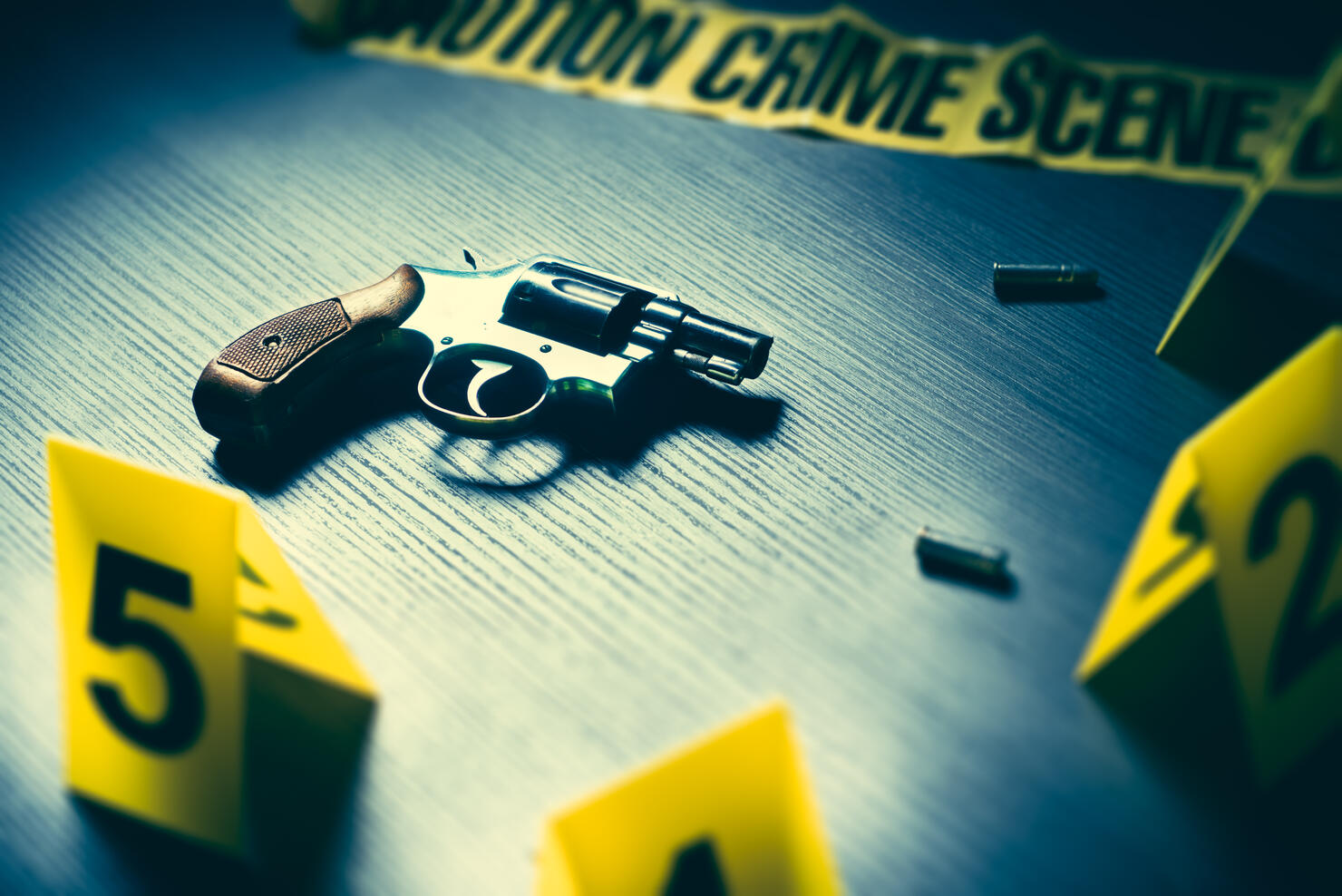 Crime scene with gun and evidence markers