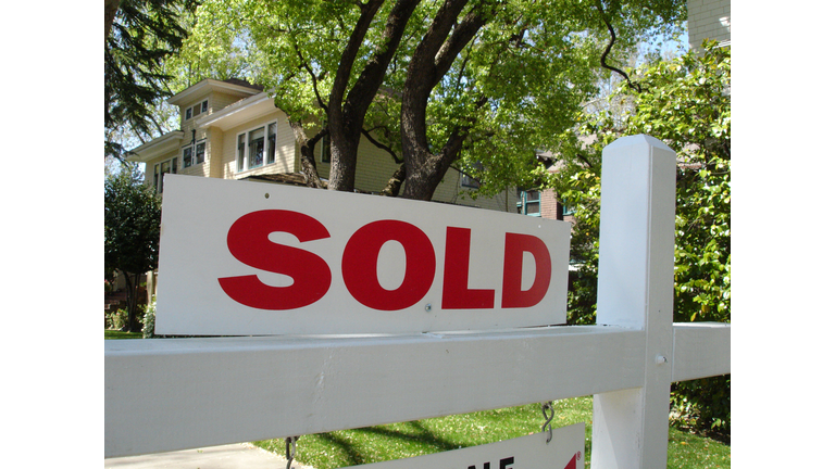 Sold California real estate sign and mansion house home