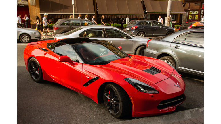 Red muscle car Chevrolet Corvette C7 Liberty parked in the city