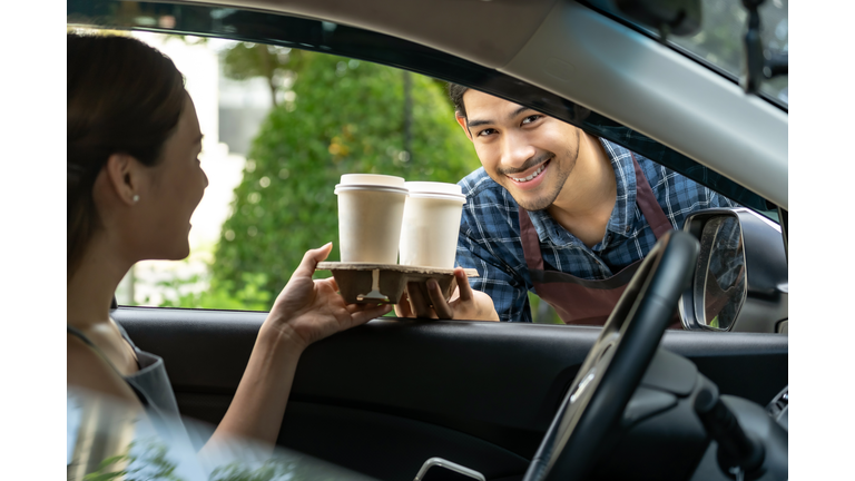 Waiter deliver food throght drive thru service