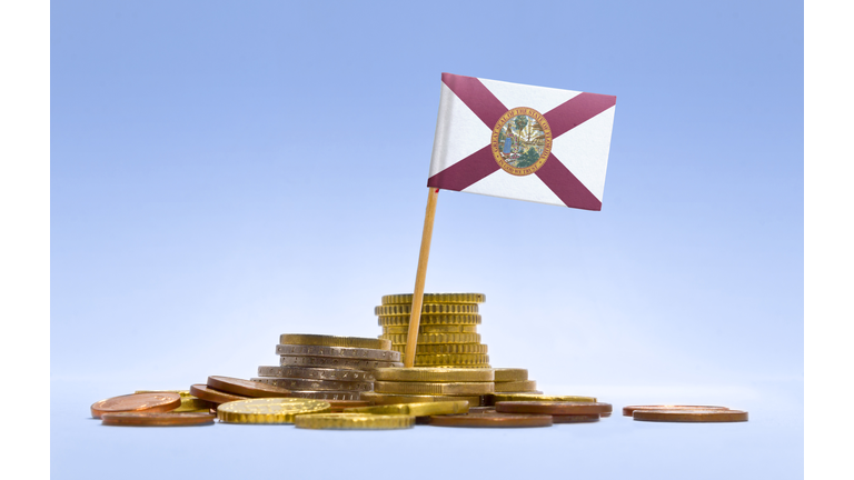 Flag of Florida in a stack of coins.(series)