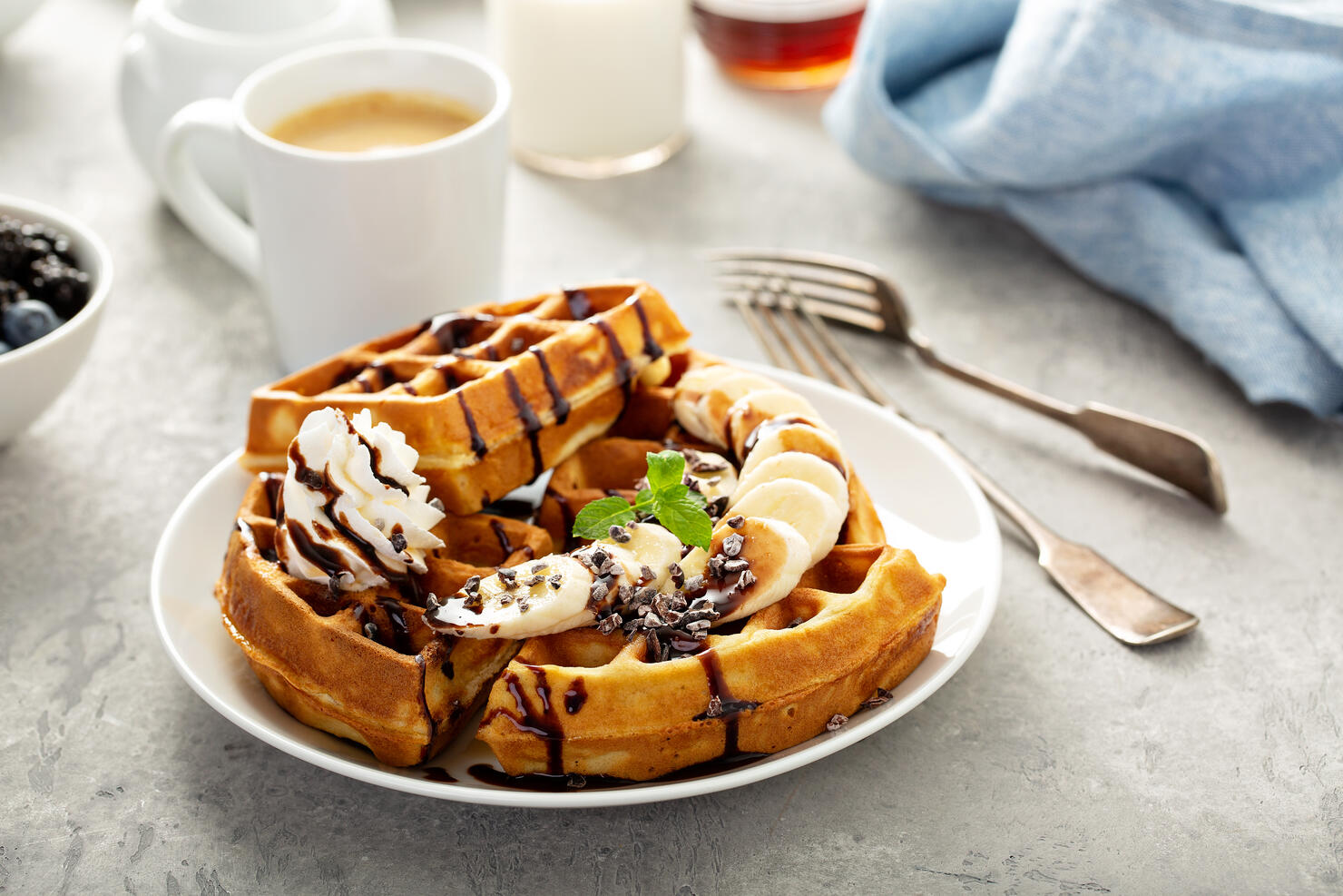 Breakfast waffles with bananas and chocolate