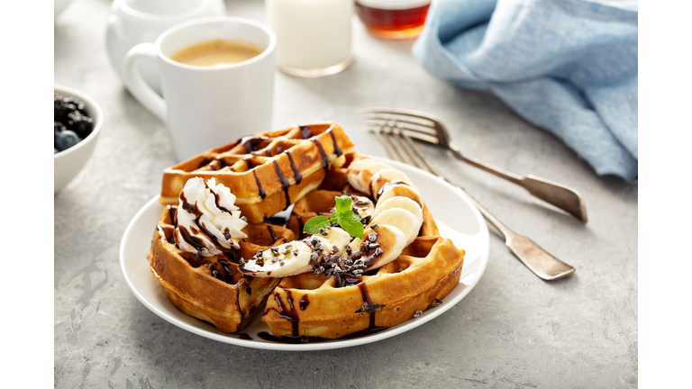 Breakfast waffles with bananas and chocolate
