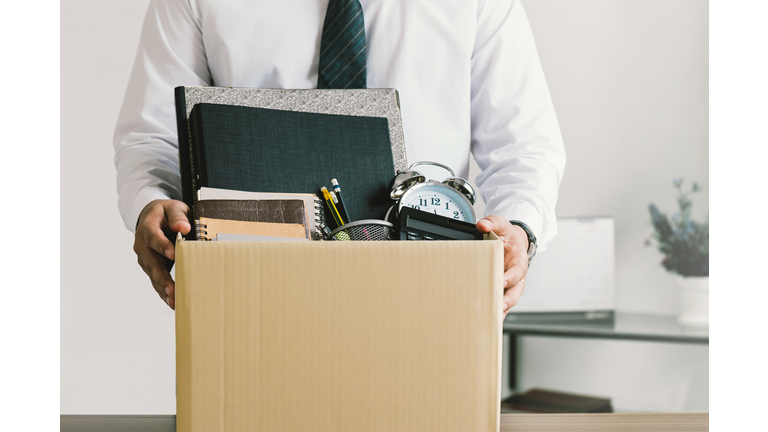 Resignation. businessmen holding boxes for personal belongings and resignation letters.Quitting a job,The big quit.The great Resignation.